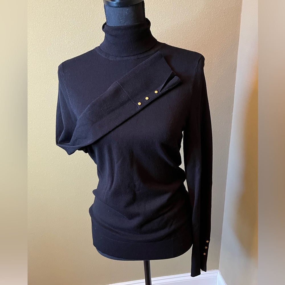 WHBM black long sleeve turtle neck top.  Accent studs on sleeves Size small